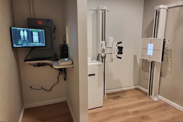 Digital X-ray machine and control station in a modern chiropractic clinic.
