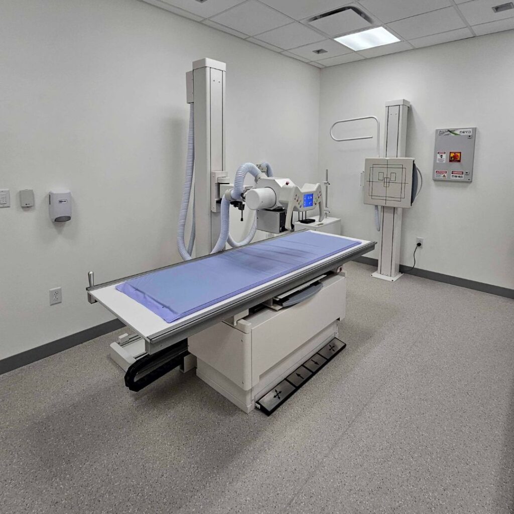 Advanced digital radiography DR system and medical X-ray imaging equipment in a modern clinical diagnostic room.