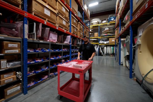 Warehouse inventory of medical imaging parts including GE and Siemens components.