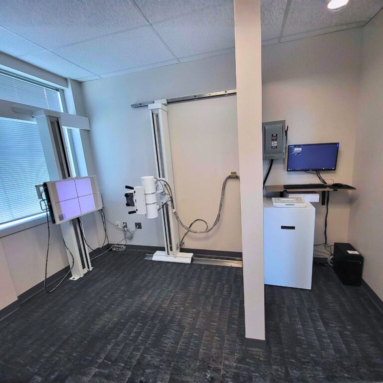 Advanced stationary upright X-ray machine for precise patient positioning and high-resolution clinical imaging.