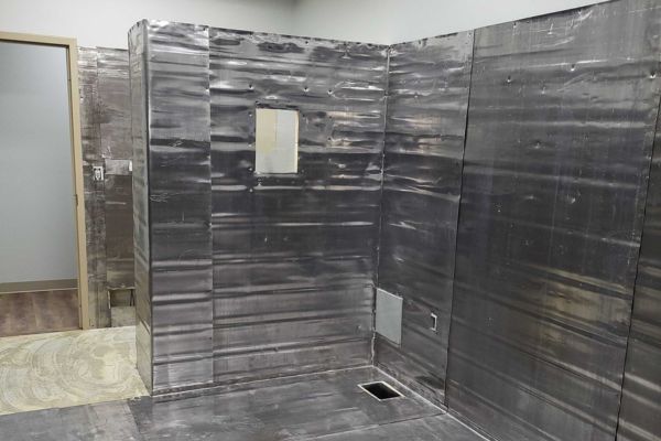 Lead shielding installation for X-ray room radiation protection during medical facility construction.